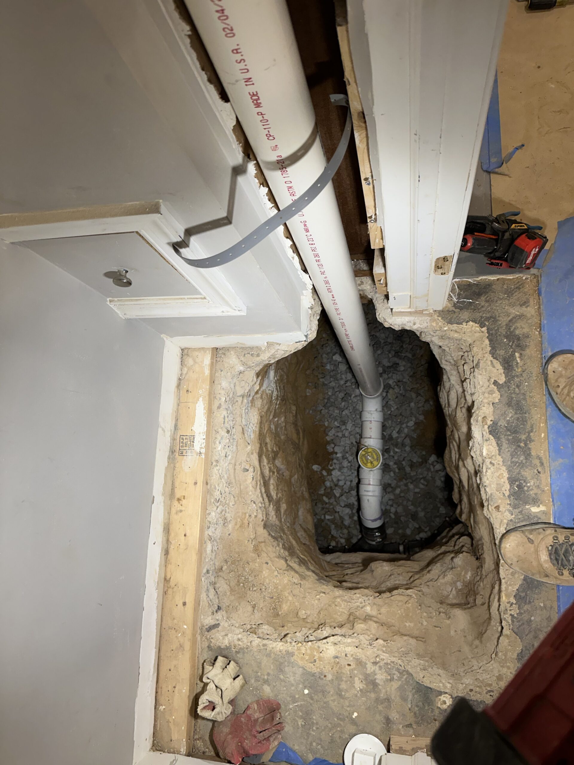 photo showing new drain line that will connect new row house powder room to existing plumbing