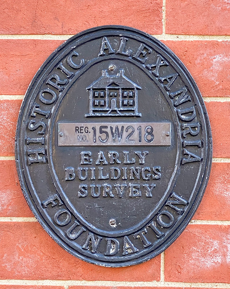 Historic Alexandria Foundation Early Buildings Survey plaque mounted on a brick wall in Alexandria